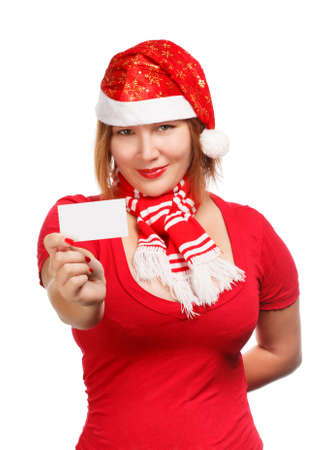 Beautiful young woman in christmas suit holding advertisement card isolated on white backgroundの写真素材