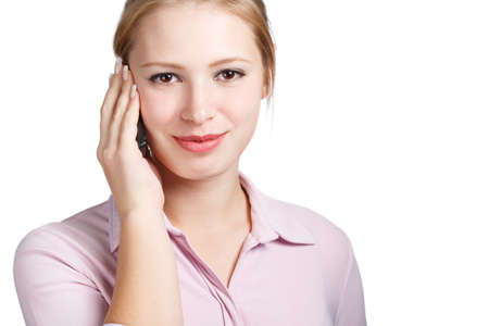 Young woman with mobile phone in hand calling isolated on white background. Close up.の写真素材