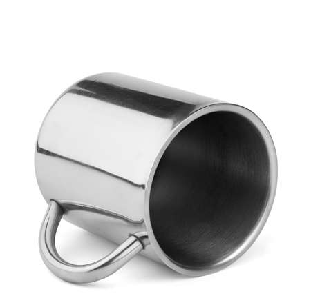 Shiny stainless steel travel thermo cup with handle lay isolated on white backgroundの写真素材