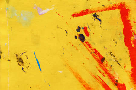 Grunge abstract background on canvas painted with yellow paint and colorful random strokes. Shallow dof. Copyspace.の写真素材