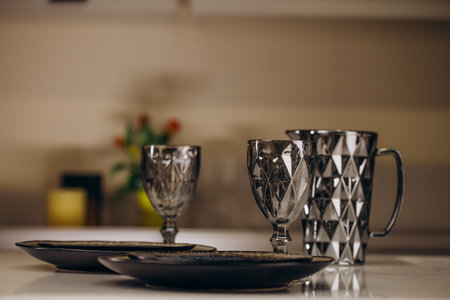 Champagne Bottle in Metallic Bucket, Wine Glasses and Ripe Green Apples on Wooden Table. Kitchen Utensil, Sink and Faucet, Light on Blurred Background. Alcoholic Drink Horizontal Photographyの写真素材
