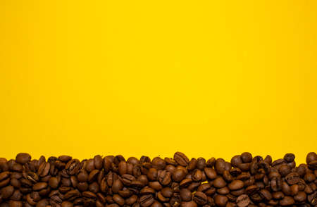 coffee beans on a yellow background, concert coffee symbolの写真素材
