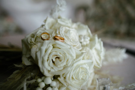 Wedding rings on a flowerの写真素材