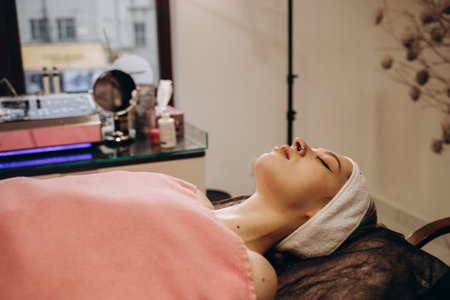 Cosmetologist is a professional with a patient in the office of.の写真素材