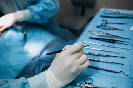 scrub nurse preparing medical instruments for operation.の写真素材