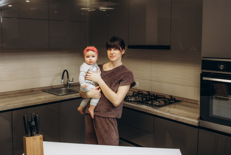 Healthy food at home. Happy family in the kitchen. Mother and child daughter are preparing the vegetables and fruit.の写真素材