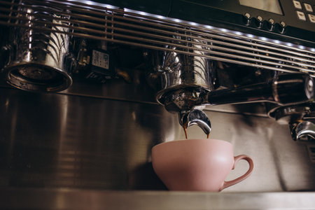 Coffee machine in steam, barista preparing coffee at cafe.の写真素材
