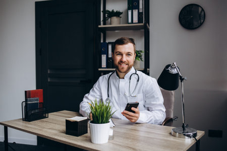 doctor sitting at table in consulting roomの写真素材
