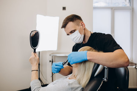 Botox, injection and antiaging with a senior woman in studio on a gray background with hands in...
