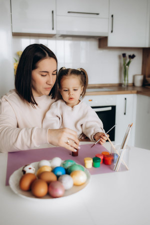 mother and daughter are preparing for Easter, hugging, smiling, spending, enjoying time together,...