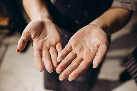 Hands together make ceramics pregnant girl with a manの写真素材
