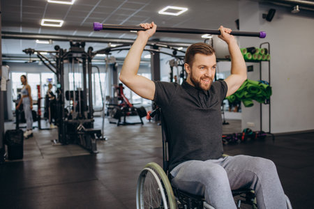 Person who uses a wheelchair training in the gym. Rehabilitation center
