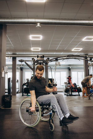Hardworking person with a disability exercising with weights in the gym