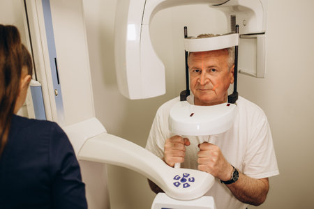 the doctor makes an x-ray of the head of an elderly person.の写真素材