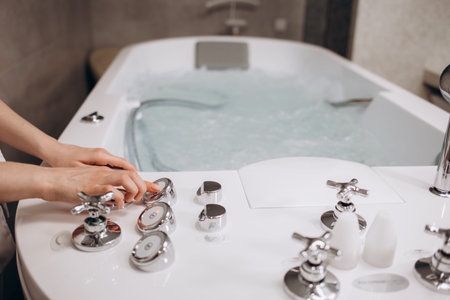 White whirlpool bath with rock ready to take a bath. high quality photo