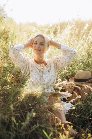 a woman artist paints a picture in nature. High quality photoの写真素材