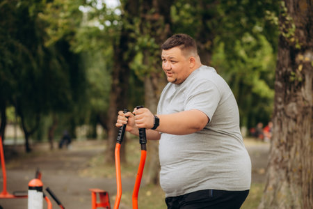 a fat man is doing sports in natureの写真素材