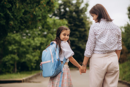Mom takes her daughter to school. Back to school. High quality photoの写真素材