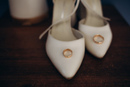 Wedding. Details. Exclusive bride's shoes and wedding rings. High quality photoの写真素材