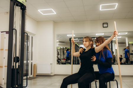 a rehabilitation specialist is rehabilitating a woman's back. Correction of scoliosis. Meal therapy