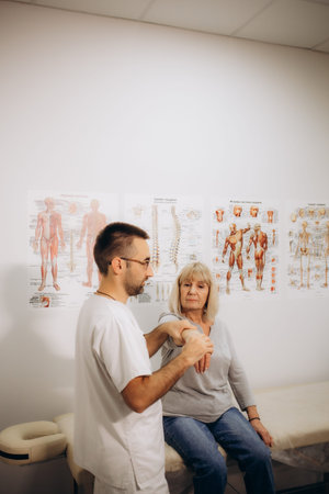 Senior woman getting the neck adjustment done in the medical office. High quality photo