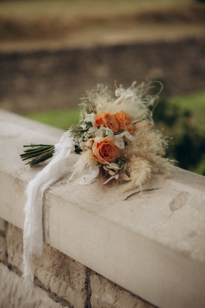Bride's bouquet lying on twigs outdoors. High quality photoの写真素材