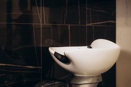 Hair wash sink for washing hair in beauty salon or Barber shop, shampoos, towels. Hairdresser...