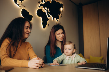 a young mother chooses a vacation in a travel agencyの写真素材