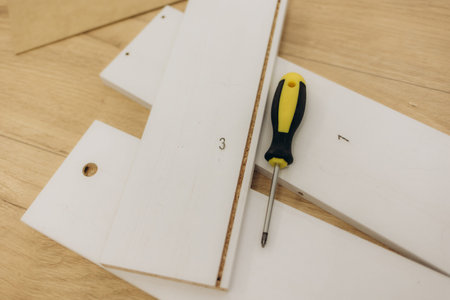 the process of furniture assembly screws closeup