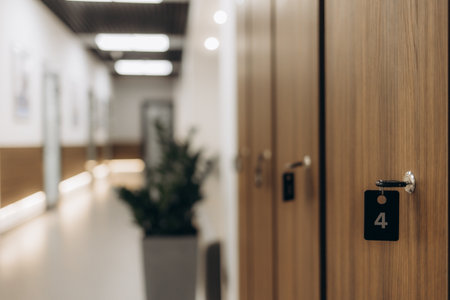 Close-up of typical grey metal school lockers with keys in the doors.の写真素材