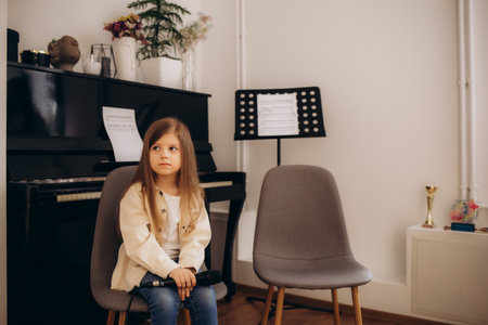 a portrait of a young girl at vocal lessonsの写真素材