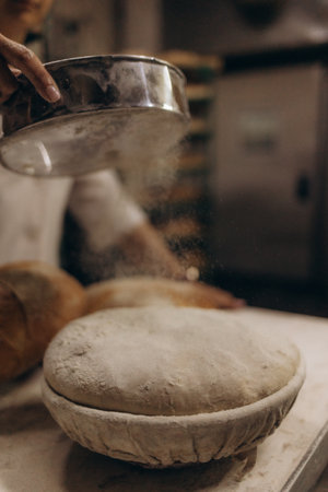 raw bread in baking moulds at the bakeryの写真素材