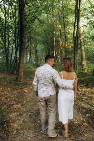 A happy couple walking in the parkの写真素材