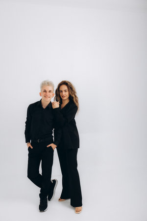 a couple in a black suit on a white backgroundの写真素材