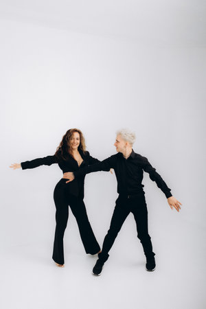 beauty couple dancing social danse kizomba or bachata or semba , on light grey backgroundの写真素材