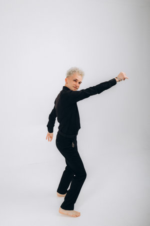 man dancing bachata on a white backgroundの写真素材