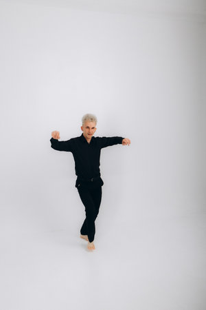 man dancing bachata on a white backgroundの写真素材