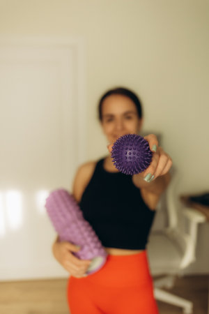 Young female athletes practice hatha yoga during class. Lover of active lifestyle on yoga mat perform doing butterfly pose in gymの写真素材