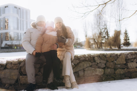 Family on a winter vacation spending time together outdoors
