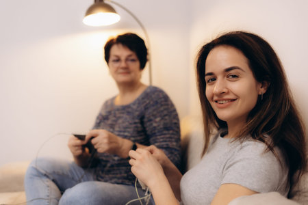 Mother and daughter have fun knitting