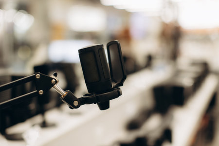 Focused view of a high-quality microphone mounted on a boom arm, displayed in a contemporary...