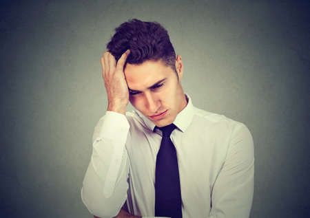 Portrait of a depressed business man.の写真素材