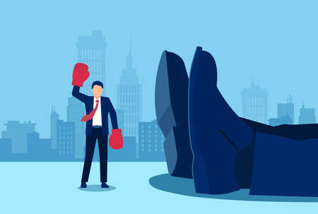 Vector of a small businessman with boxing gloves and arms raised in victory standing near a giant rival fallen down. のイラスト素材