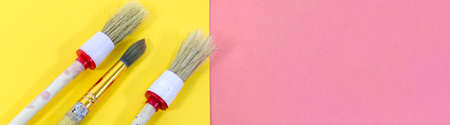 Brushes for painting on a colorful background, art, place for textの写真素材
