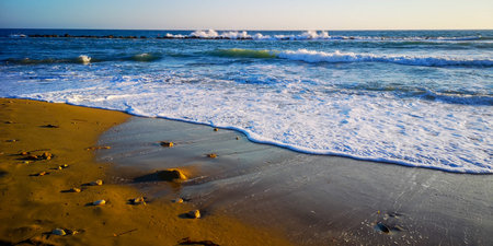 Blue Mediterranean sea waves and rocky seashore. High quality photo