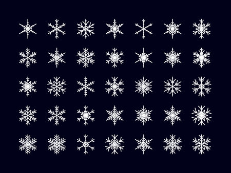 Vector set of different snowflakes icons on black backgroundのイラスト素材