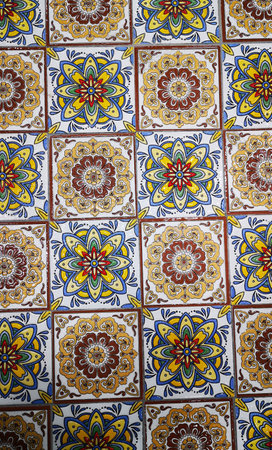 pattern of traditional Mediterranean ceramic tiles with colorful floral geometric motifs. Portuguese azulejo tiles, mexican talavera, italian spanish majolica. Vintage tiled floor print for ceramic or fabric design.の写真素材