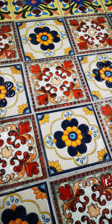 pattern of traditional Mediterranean ceramic tiles with colorful floral geometric motifs. Portuguese azulejo tiles, mexican talavera, italian spanish majolica. Vintage tiled floor print for ceramic or fabric design.の写真素材