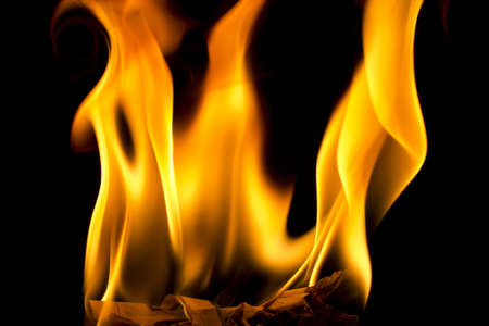 Fire burning a piece of paperの写真素材