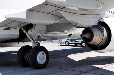 Commercial airliner: landing gear and jet engine detail.の写真素材
